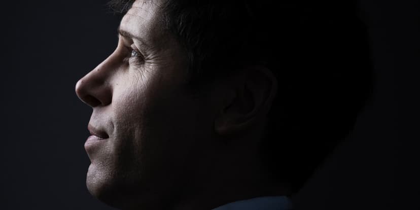 Green double couch with wooden legs