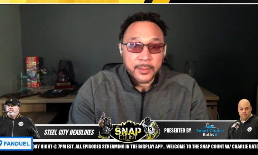 Green double couch with wooden legs