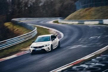 Green double couch with wooden legs