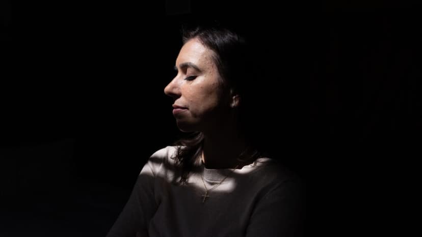 Green double couch with wooden legs